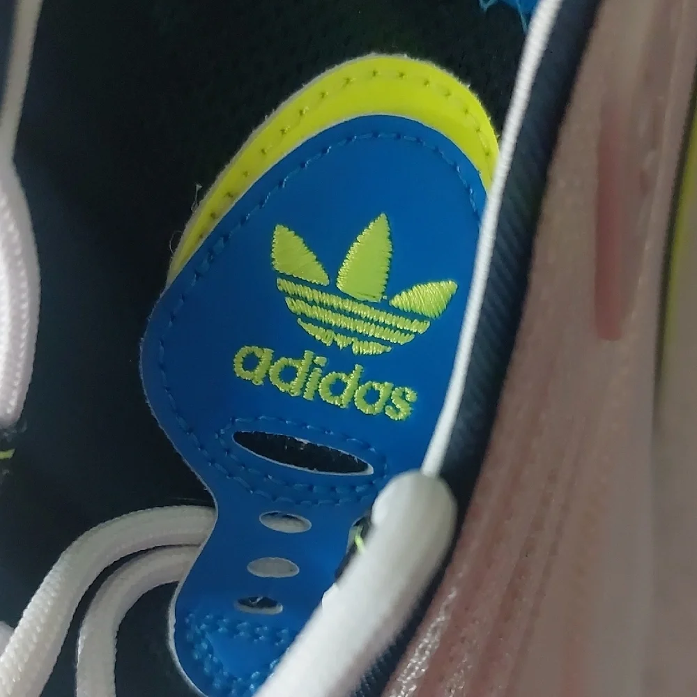 Adidas Adifom SLTN shoes in the Cloud White / SolarYellow / Blue Colorway